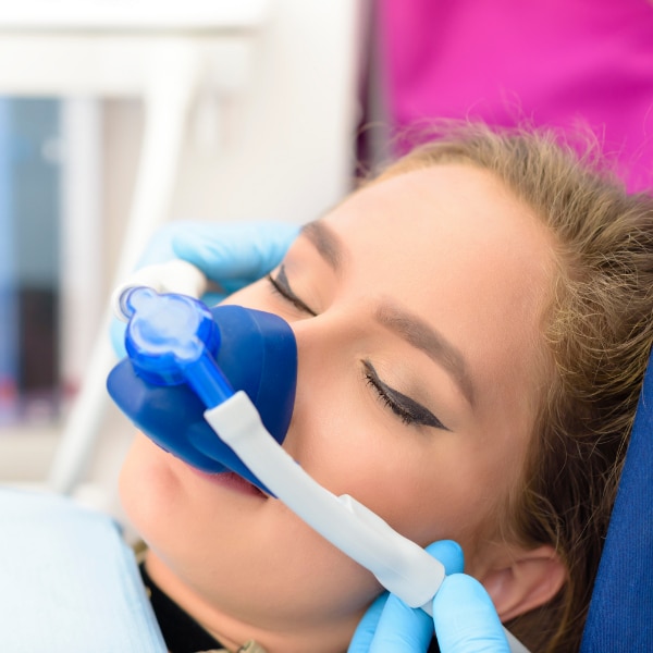 woman receiving sedation treatment