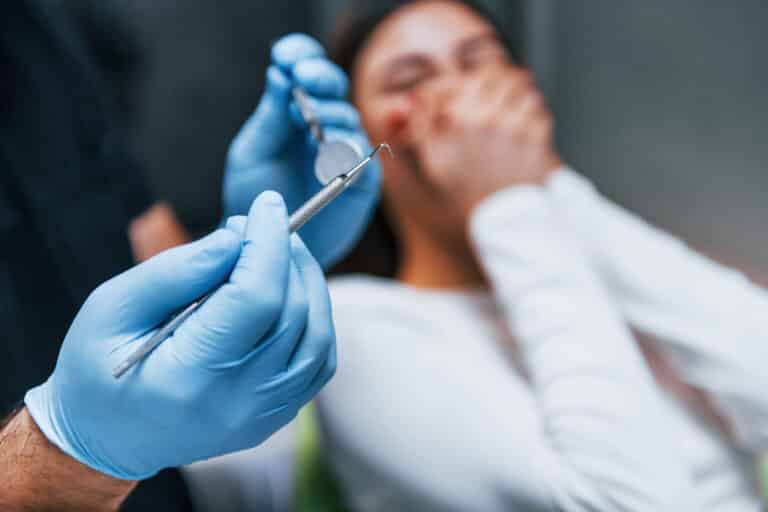 scared woman have a visit in the dentist clinic c 2023 11 27 05 26 38 utc scaled